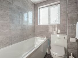 A bathroom with a bathtub and toilet at Luxury 2 Bed Room Lake View Apt Bowness Parking Bowness-On-Windermere
