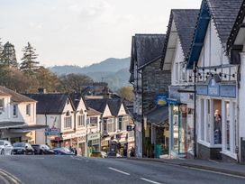 A street with shops and houses at Luxury 2 Bed Room Lake View Apt Bowness Parking in Bowness-On-Windermere