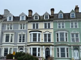 A row of houses with various colored facades at Sea View, East Parade Llandudno