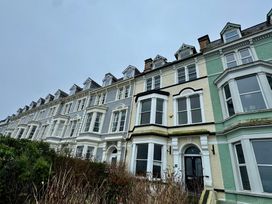 A row of houses with various colored facades at Sea View, East Parade, Llandudno
