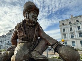 A sculpture of a sitting figure at Sea View, East Parade, Llandudno