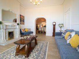 A living room with a chess set and sofa at Sea View, East Parade, Llandudno