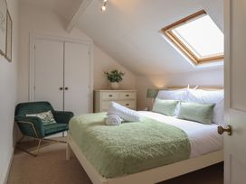 A bedroom with a double bed and wardrobe at Sea View, East Parade, Llandudno