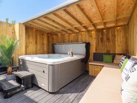 An outdoor space featuring a hot tub and seating area at Sea View, East Parade, Llandudno