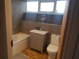 A bathroom with bathtub, sink and toilet at 3 Bed Barn - Sleeps 6 - Parking - Wifi in Hawkshead