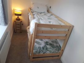 A bedroom with a loft bed and a lamp at 3 Bed Barn - Sleeps 6 - Parking - Wifi, Hawkshead