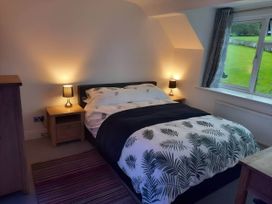 A bedroom with a bed and bedside lamps at 3 Bed Barn - Sleeps 6 - Parking - Wifi, Hawkshead