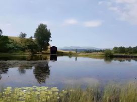 A landscape with a lake, trees, and a shed at 3 Bed Barn - Sleeps 6 - Parking - Wifi in Hawkshead