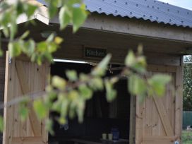 A kitchen entrance with a sign at Restored circus wagon Saltburn-By-The-Sea