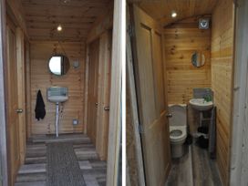 A bathroom with a sink and toilet at Restored circus wagon Saltburn-By-The-Sea