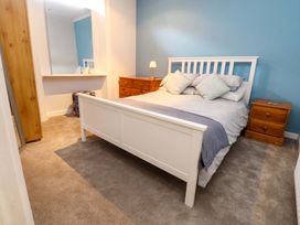 A bedroom with a bed and bedside tables at Flat 2, Dorstan in Carnforth