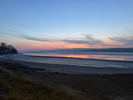 A river at sunset with sand and trees at Flat 2, Dorstan Arnside