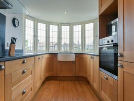 A kitchen with cabinets and a sink at Northrawe in Bamburgh