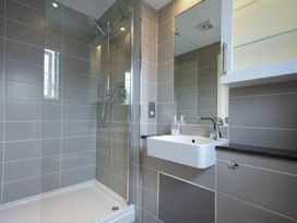 A bathroom with a shower and sink at Northrawe in Bamburgh