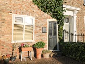 A front entrance with a door and plants at Blacksmiths Retreat in York