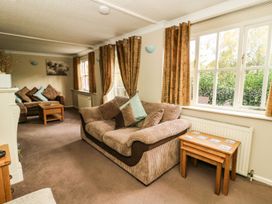 A living room with a sofa and coffee table at Blacksmiths Retreat in York