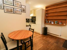 A kitchen with a table and chairs at Blacksmiths Retreat in York