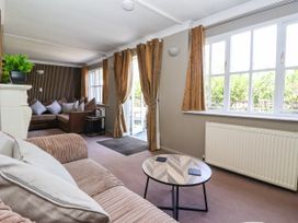 A living room with a sofa and coffee table at Blacksmith Mews in York