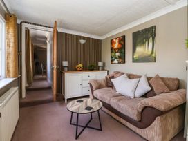 A snug with a sofa and coffee table at Blacksmith Mews in York
