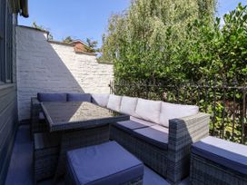 An outdoor seating area with a table and a sofa at Blacksmith Mews in York
