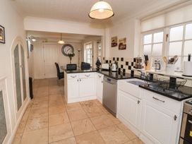 A kitchen with cabinets and appliances at Blacksmiths Mews in York