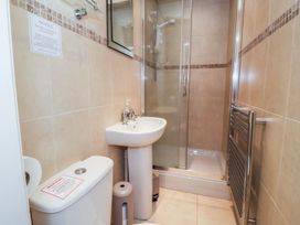 A bathroom with a shower and sink at Blacksmiths Mews in York