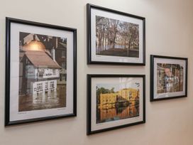 Four framed photographs on a wall at Blacksmiths Mews in York