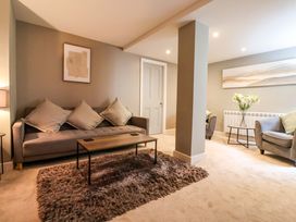A living room with a sofa and coffee table at Blacksmiths Retreat in York