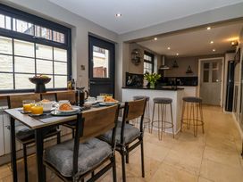 A kitchen with a dining table and breakfast items at Blacksmiths Retreat in York
