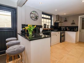 A kitchen with a counter and appliances at Blacksmiths Retreat in York