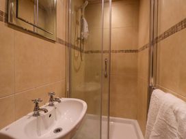 A bathroom with a sink and shower at Blacksmiths Retreat in York