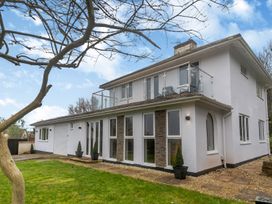 A house with a balcony and garden at Broadsands in Paignton