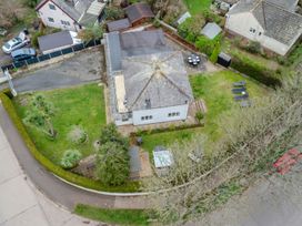 An aerial view of a house with garden and patio at Broadsands in Paignton