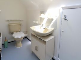 A bathroom with a toilet and sink at 32 Bowleaze Coveway Weymouth