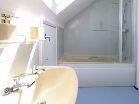 A bathroom with a sink and bathtub at 32 Bowleaze Coveway Weymouth