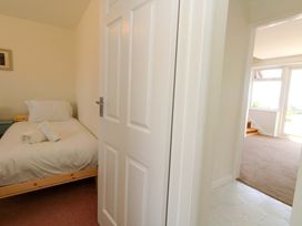 A bedroom with a bed and towel at 32 Bowleaze Coveway Weymouth