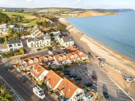 A view of houses and beach near the ocean at 32 Bowleaze Coveway in Preston