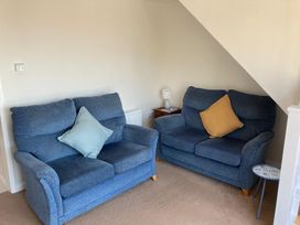 A snug area with two sofas and a side table at Bella Rosa Preston