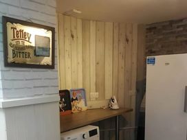 A kitchen with a fridge and microwave at House - Sleeps 7 - Garden - Pets Ok - Parking in Torquay