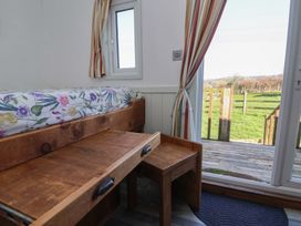 A bedroom with a bed and drawer at Shepherds Delight in Biddulph Moor