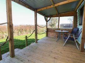 An outdoor patio with a table and chairs at Golden Fleece in Biddulph Moor