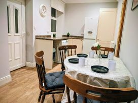 A dining room with a table and chairs at 4 The Croft in Hexham
