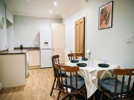 A kitchen with a dining table and chairs at 4 The Croft in Hexham