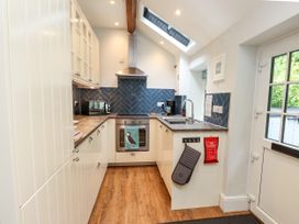 A kitchen with cabinets and countertop at 3 Tre Felin Llandygai near Bangor