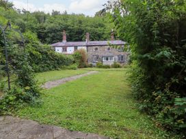 A house with a garden and pathway at 3 Tre Felin in Llandygai near Bangor