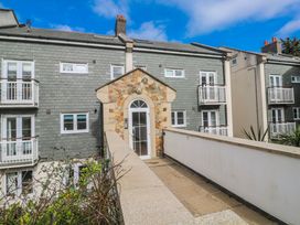 An entrance to a building with balconies at 21 Compass Point in Carbis Bay