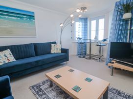 A living room with a sofa and coffee table at 21 Compass Point Carbis Bay