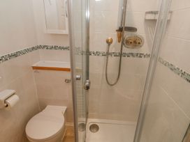 A bathroom with a shower and toilet at 21 Compass Point Carbis Bay