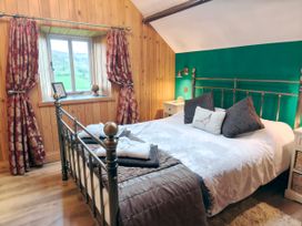 A bedroom with a bed and window at Kaber Chapel in Kaber near Kirby Stephen