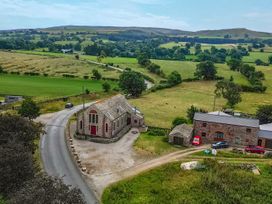 A building by the road surrounded by fields at Kaber Chapel near Kirkby Stephen